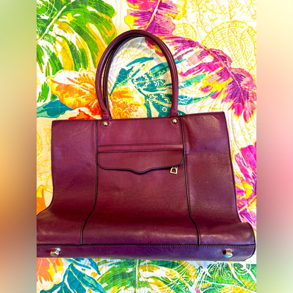 Gently used Rebecca Minkoff leather tote. Inside clean…small marks on outside.